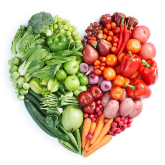 red and green fruits and vegetables formed into the shape of a heart